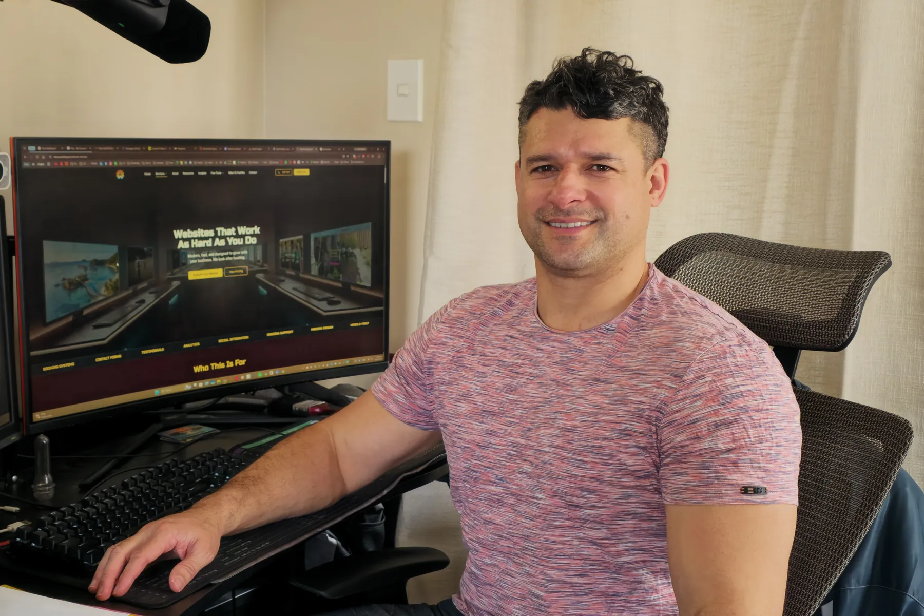 Vern Holden at his desk in Christchurch, the Taki Consulting website on his screen